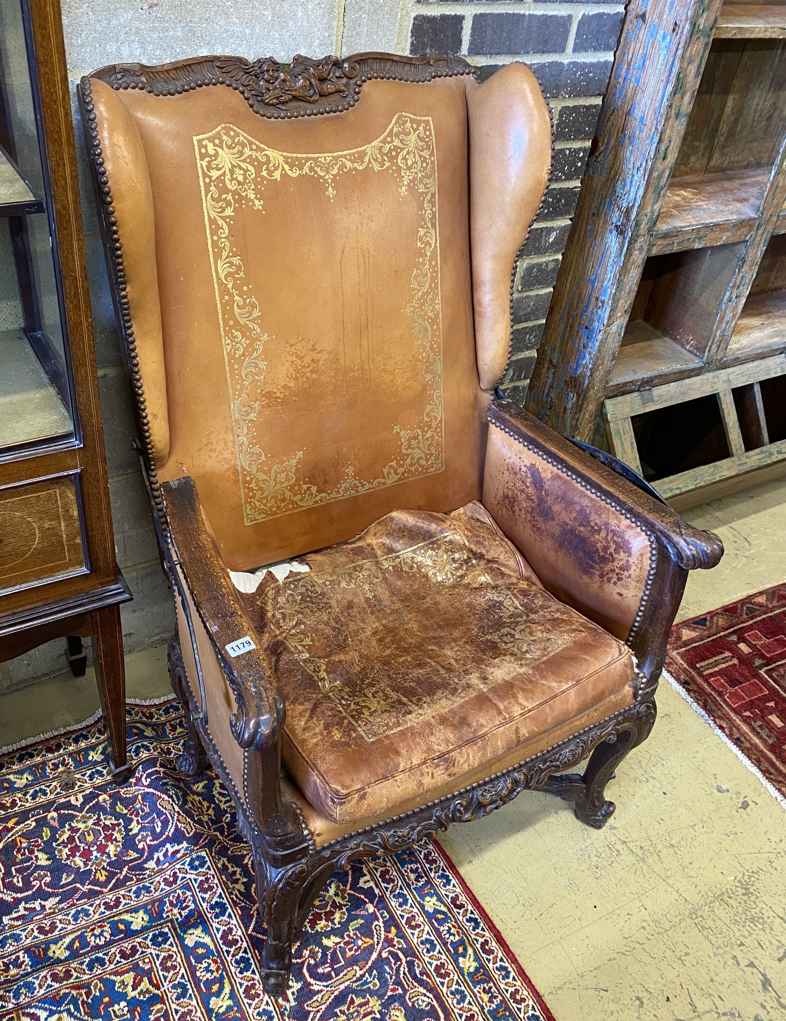 A 19th century French carved beech reclining armchair with original gilt leather upholstery, width 78cm, depth 74cm, height 114cm
